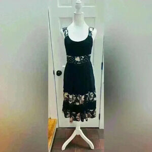 Maggy Boutique black dress, size 4, pleated bust, ties in the back, back zipper.